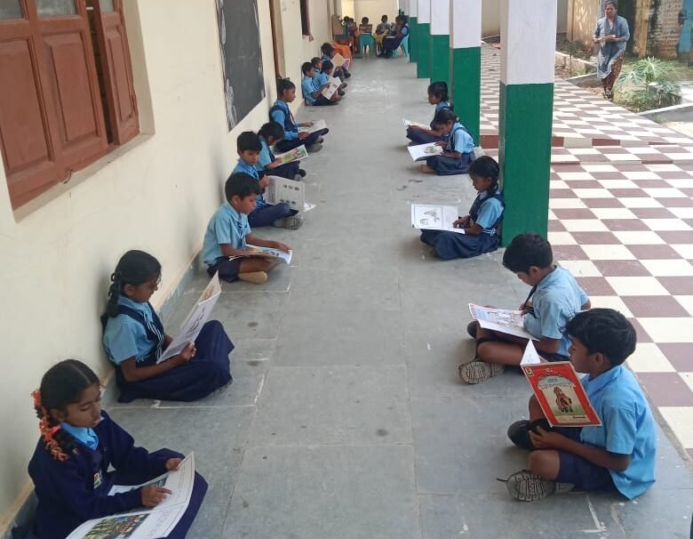 Students reading from library 1